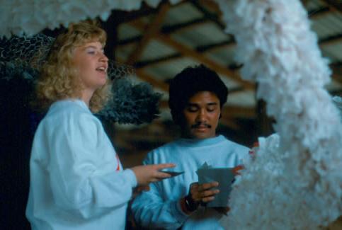 Students work on a Homecoming Float during the 1987 Northwest Homecoming Parade.  Hundreds of sorority sisters and fraternity brothers prepared lavish floats made of tissue paper and chicken wire to represent favorite cartoon characters.